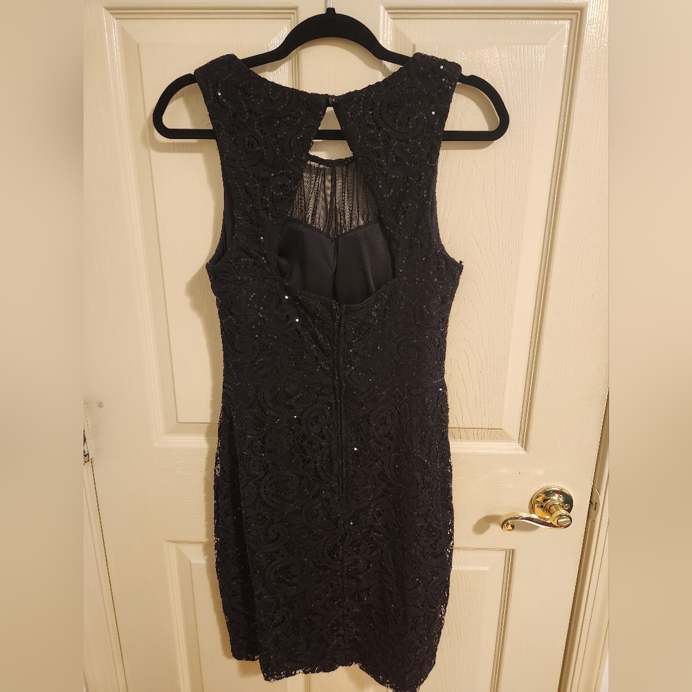 Black sequined and lace cocktail dress. Size 13 but fits like a 10 woman